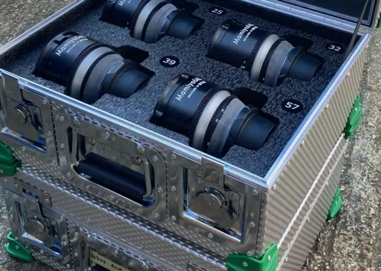 Aluminium flight case with custom foam inserts holding Mamlya lenses with labels