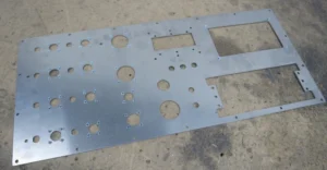 Control panel - Multiple circular holes of varying diameters